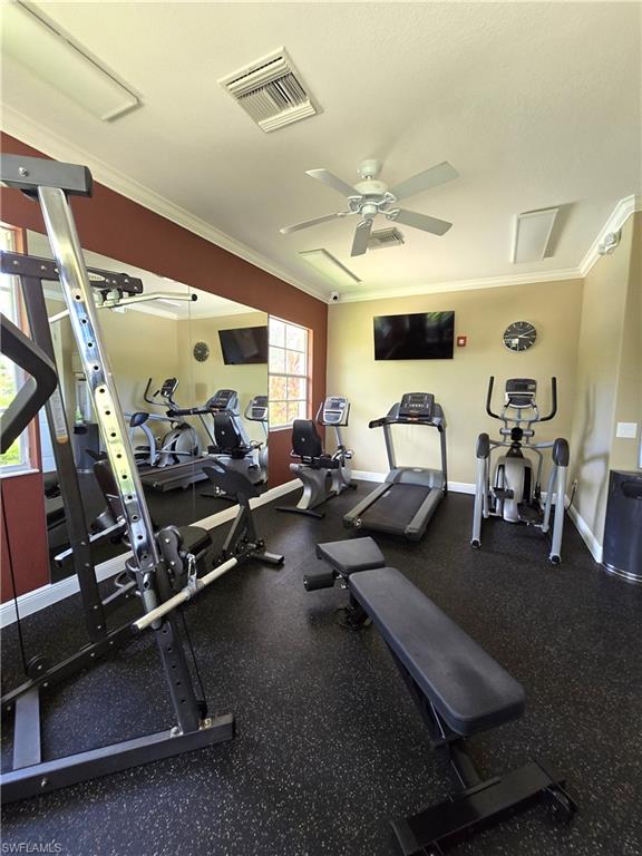 7887 Martino Circle Naples, FL 34112 - Photo 22 of 25 a room with gym equipment and a large window