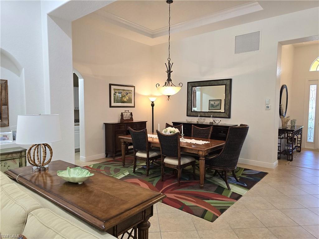 7887 Martino Circle Naples, FL 34112 - Photo 4 of 25 a view of a dining room with furniture