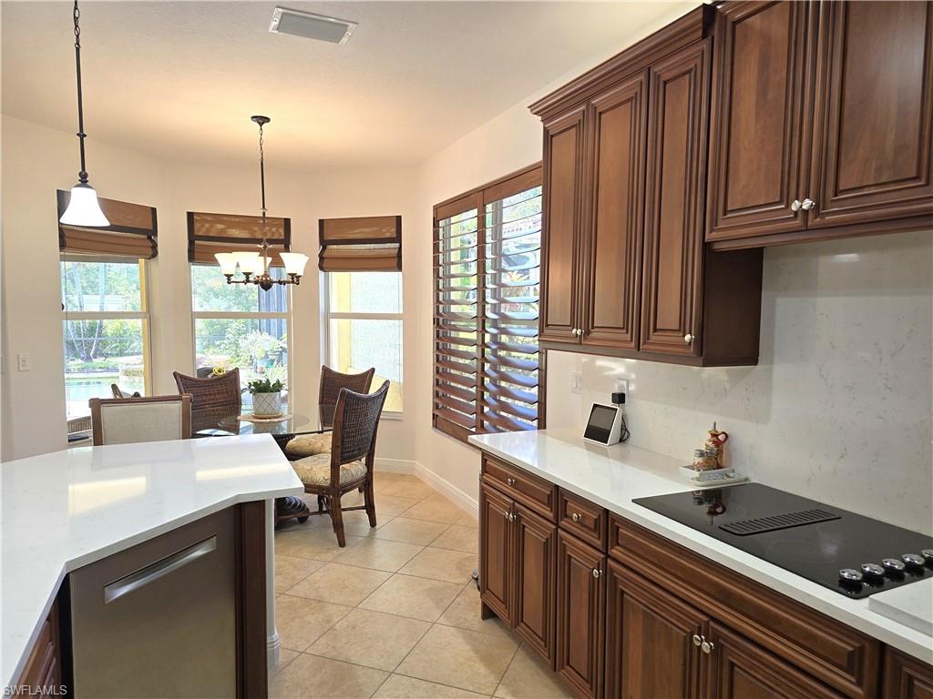 7887 Martino Circle Naples, FL 34112 - Photo 6 of 25 a kitchen with a sink cabinets and window