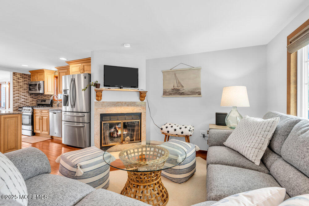 308 16th Avenue Belmar, NJ 07719 - Photo 13 of 54 a living room with furniture and a fireplace
