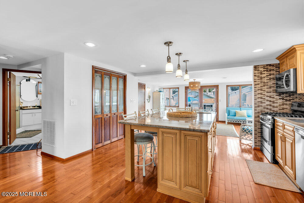 308 16th Avenue Belmar, NJ 07719 - Photo 16 of 54 a view of a kitchen with dining table and chairs