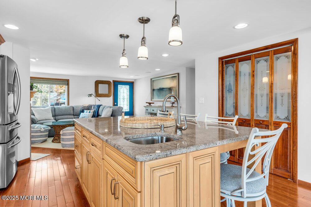 308 16th Avenue Belmar, NJ 07719 - Photo 20 of 54 a view of a kitchen counter top space with a sink and living room view