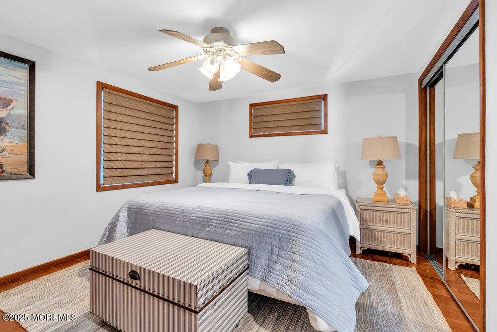 308 16th Avenue Belmar, NJ 07719 - Photo 28 of 54 a bedroom with a bed and a chandelier