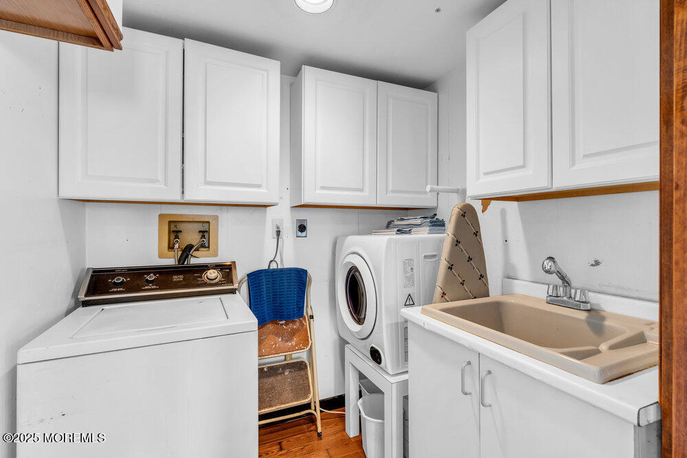 308 16th Avenue Belmar, NJ 07719 - Photo 32 of 54 a kitchen with stainless steel appliances white cabinets sink and a stove top oven