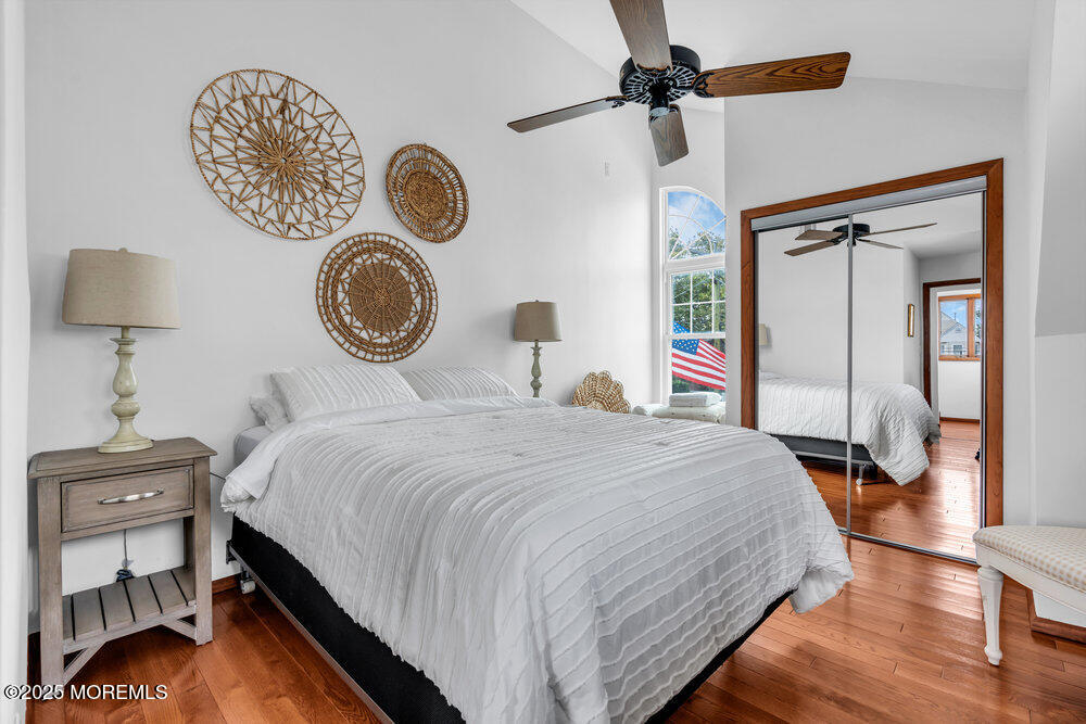 308 16th Avenue Belmar, NJ 07719 - Photo 36 of 54 a bedroom with a bed and a chandelier