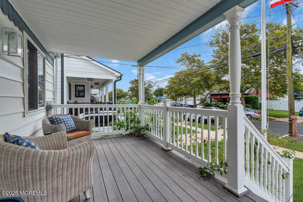 308 16th Avenue Belmar, NJ 07719 - Photo 8 of 54 a balcony with furniture and wooden floor