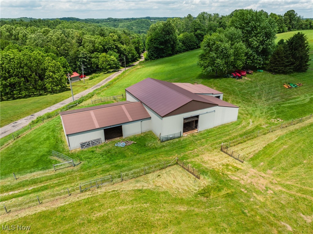 8200 Autumn Road Southwest Bowerston, OH 44695 - Photo 1 of 30 Aerial view of sparsely populated area featuring a heavily wooded area