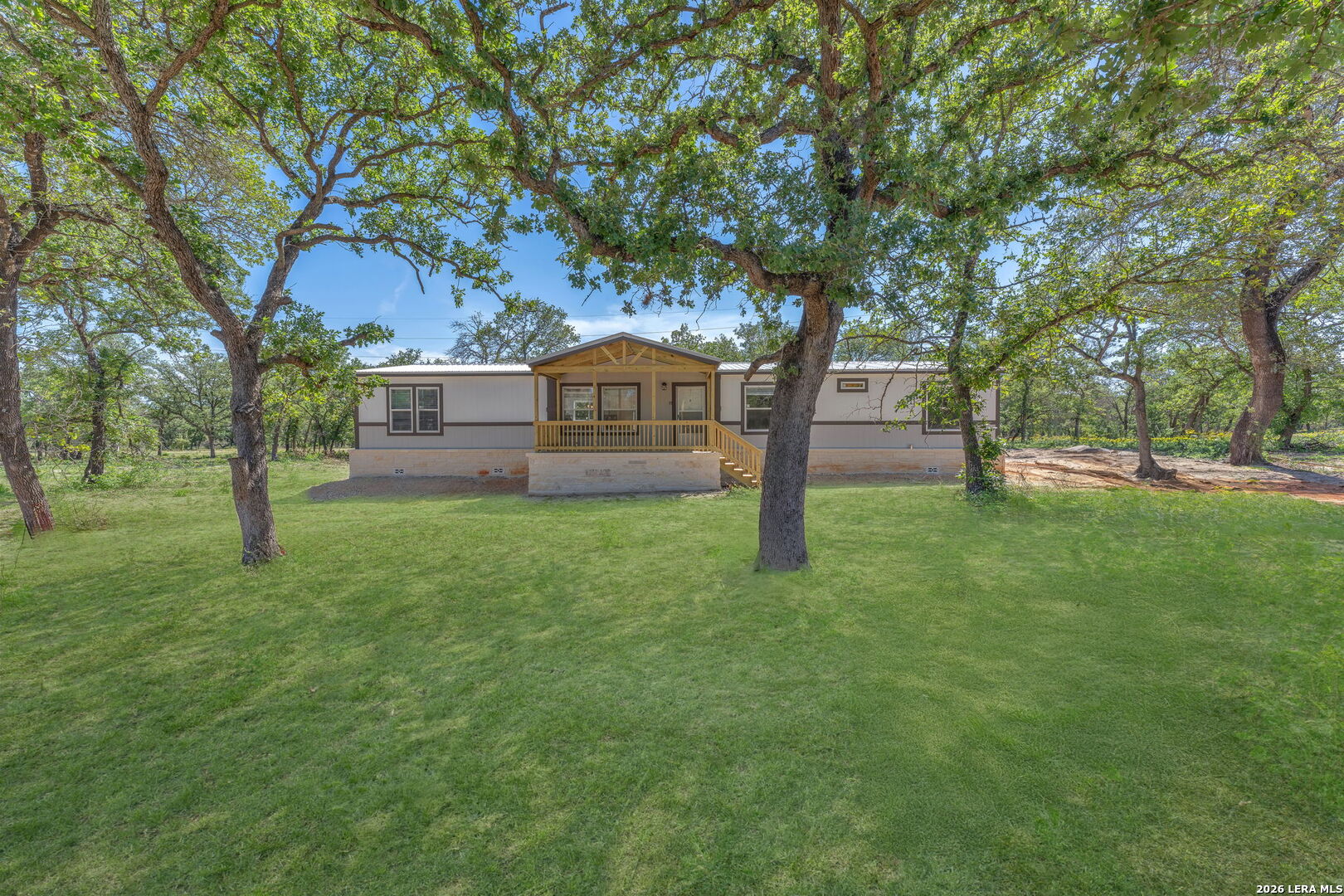 128 Syrah Street La Vernia, TX 78121 - Photo 1 of 1 a view of a yard with a house and a large tree