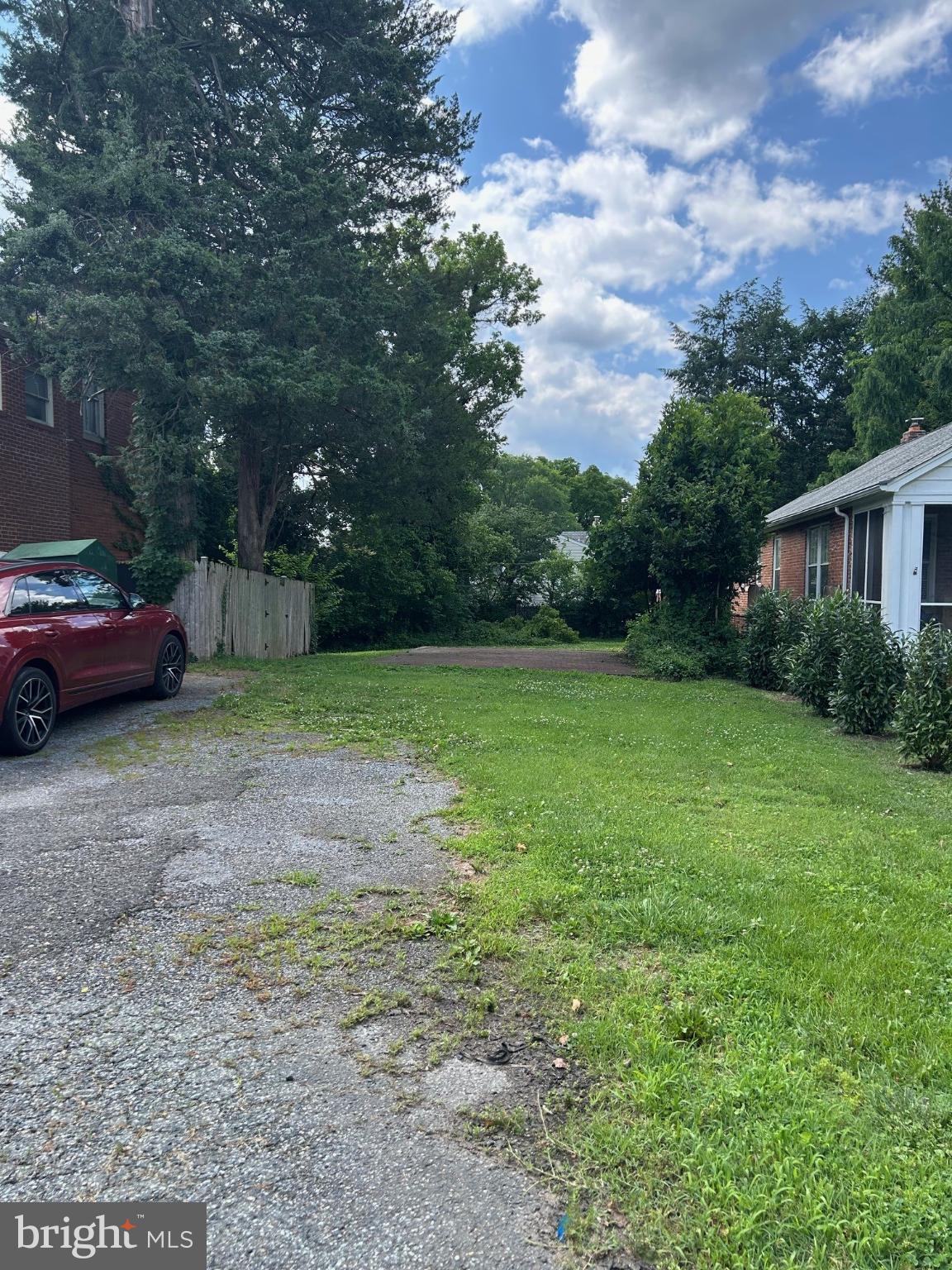 4840-4842 Western Avenue Northwest Bethesda, MD 20816 - Photo 4 of 5 Serene driveway leading to a lush retreat.