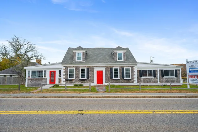 a front view of residential houses with yard and swimming pool
