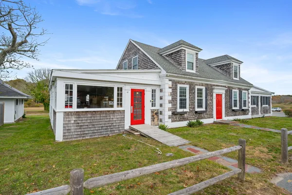 front view of a house with a yard