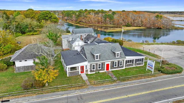 an aerial view of a house with a lake view