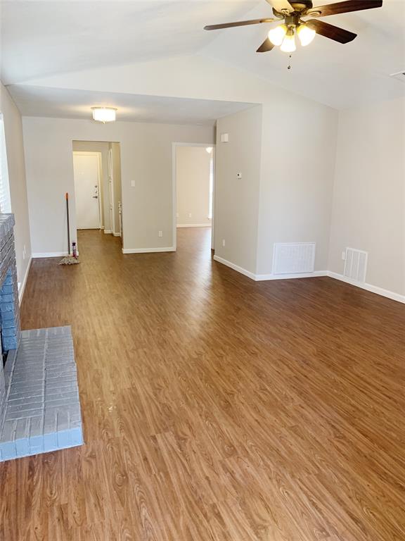 5708 Ranchogrande Drive Arlington, TX 76017 - Photo 6 of 21 wooden floor in an empty room with a window