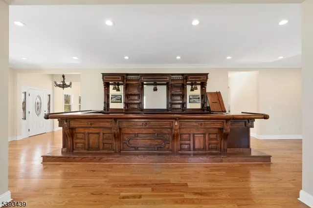 a view of kitchen with stainless steel appliances granite countertop a stove top oven