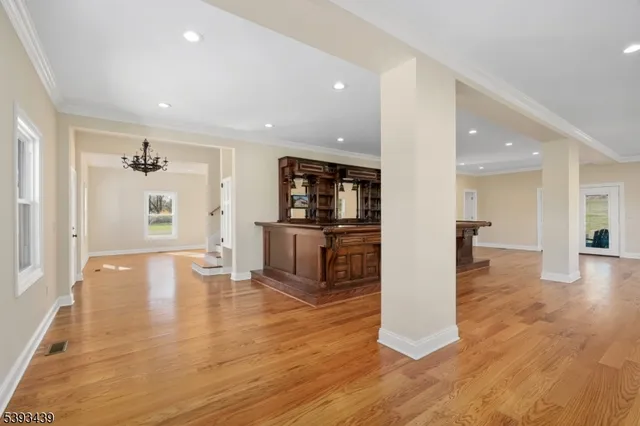 a view of kitchen with cabinets and wooden floor
