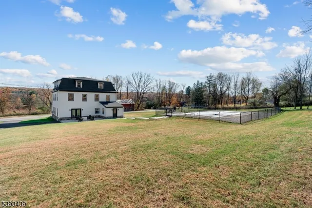 a view of a swimming pool with an outdoor seating and a garden
