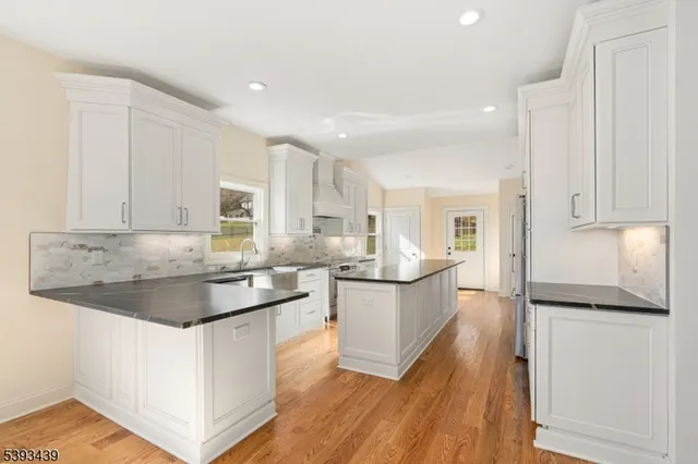 a kitchen with a sink and refrigerator