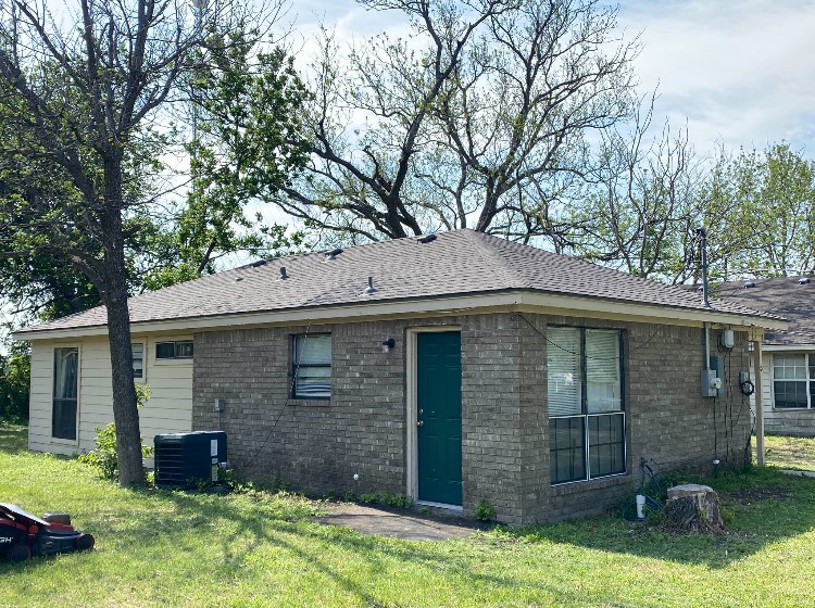 5 South 19th Street Temple, TX 76504 - Photo 2 of 16 a front view of a house with yard and tree