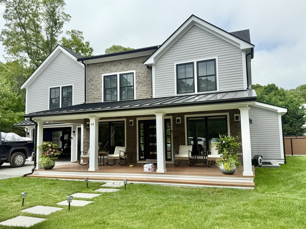 a view of a house with a yard floor and a yard floor to ceiling window