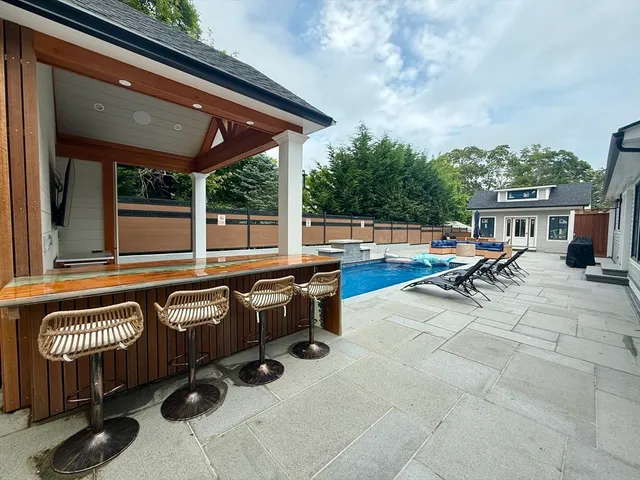 a outdoor space with patio lots of furniture and umbrella