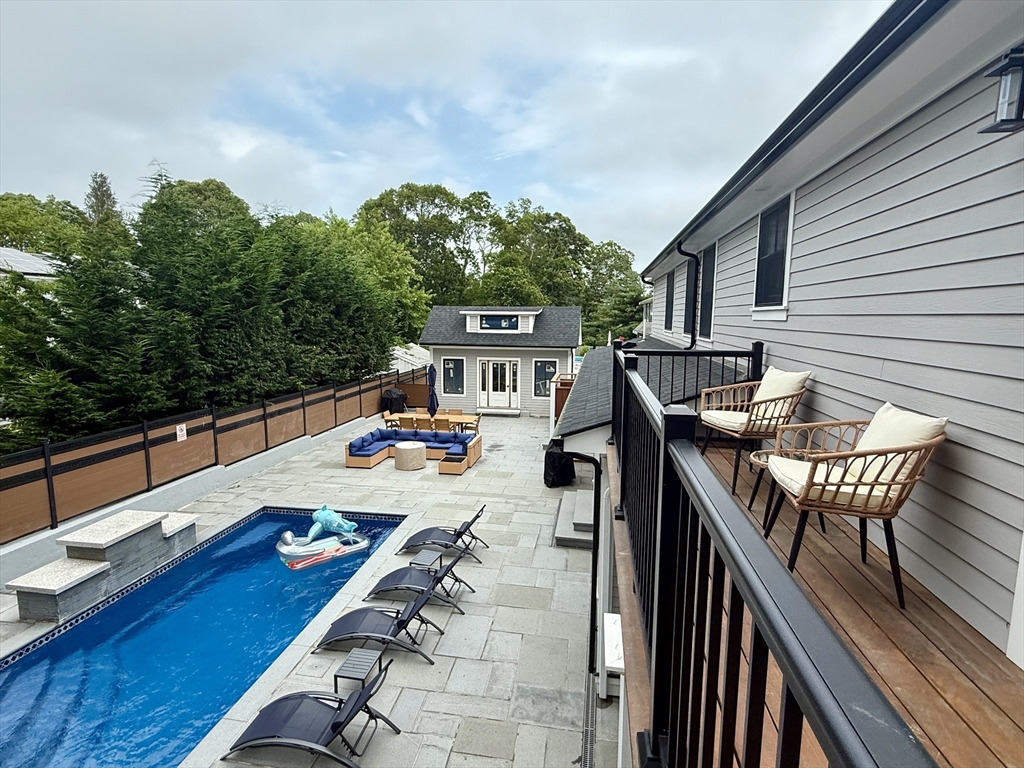 14 Bernard Circle Tisbury, MA 02568 - Photo 26 of 41 a view of deck with patio table and chairs