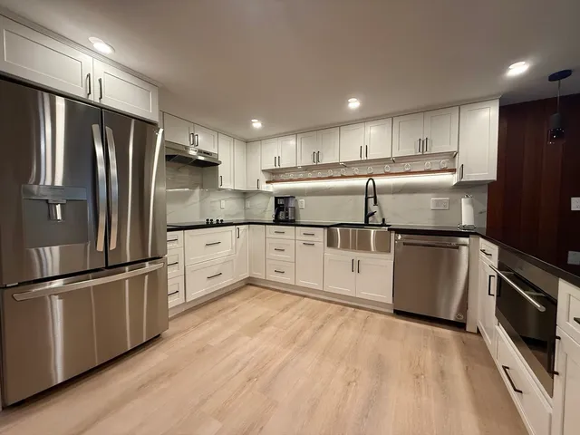 a living room with couches and a flat screen tv
