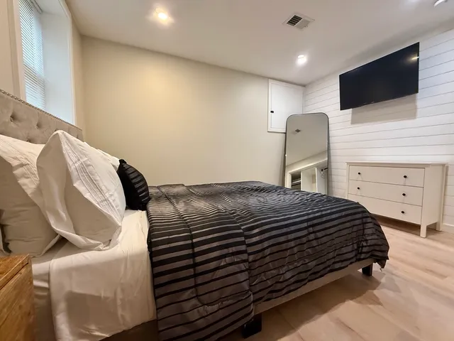 a bathroom with a shower sink and mirror