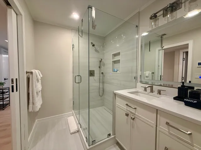 a building outdoor space with patio furniture and glass door