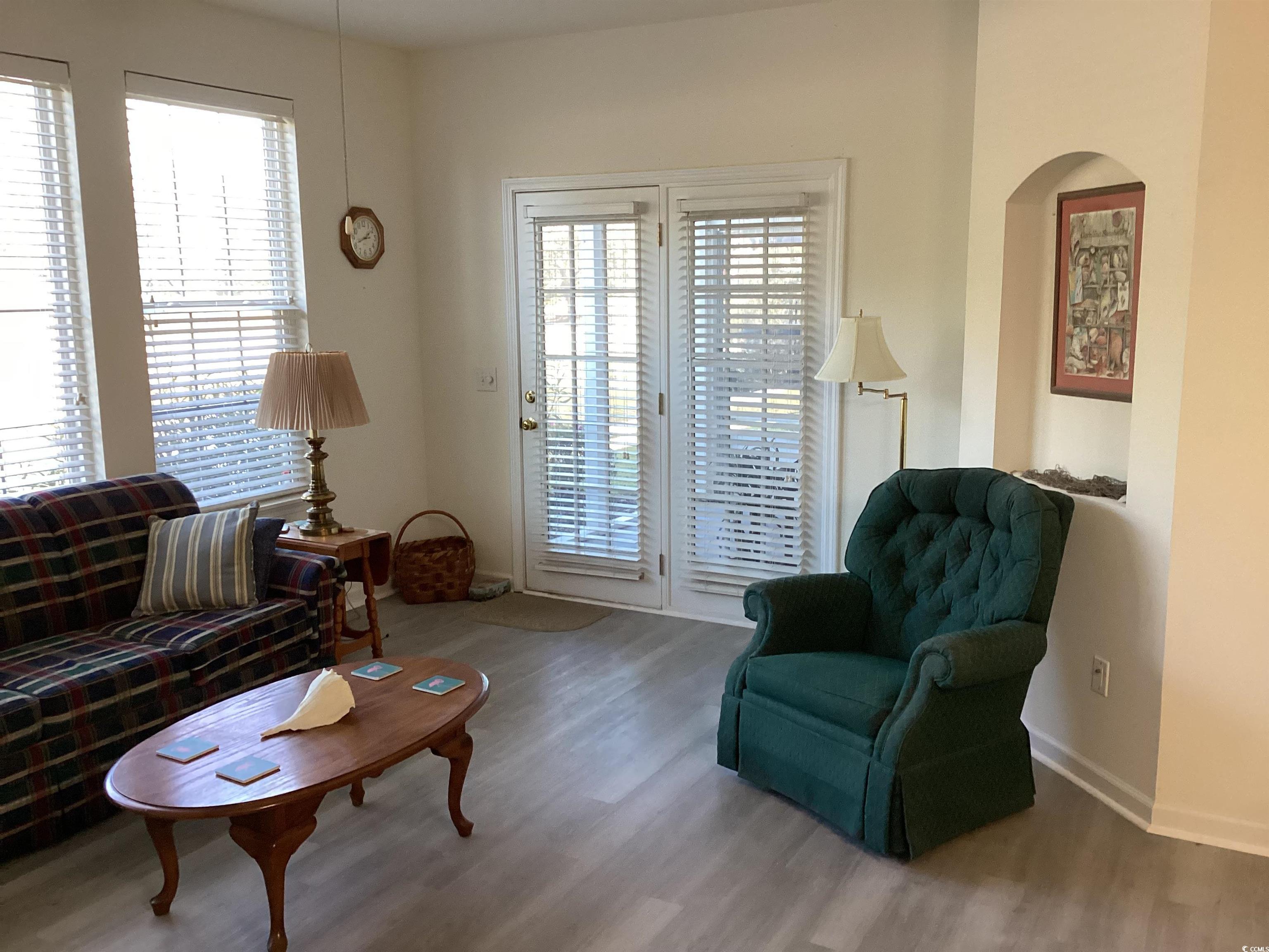 4430 Lady Banks Lane, Unit C1 Murrells Inlet, SC 29576 - Photo 12 of 34 Living room with vinyl plank floors