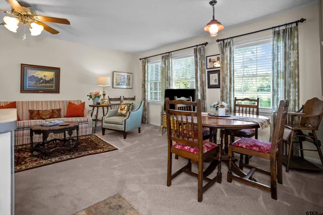 a dining room with furniture and window