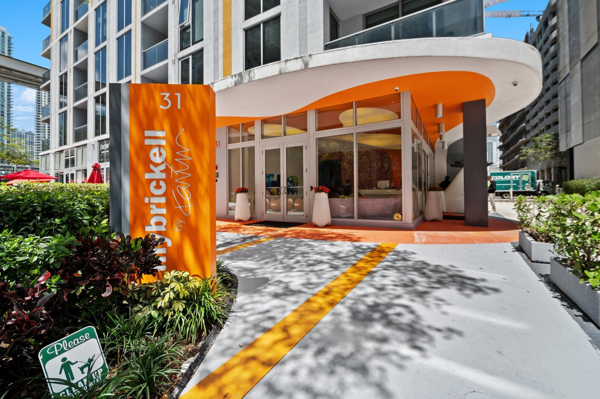 31 Southeast 6th Street, Unit 2002 Miami, FL 33131 - Photo 20 of 24 a view of a building with brick walls and flower plants