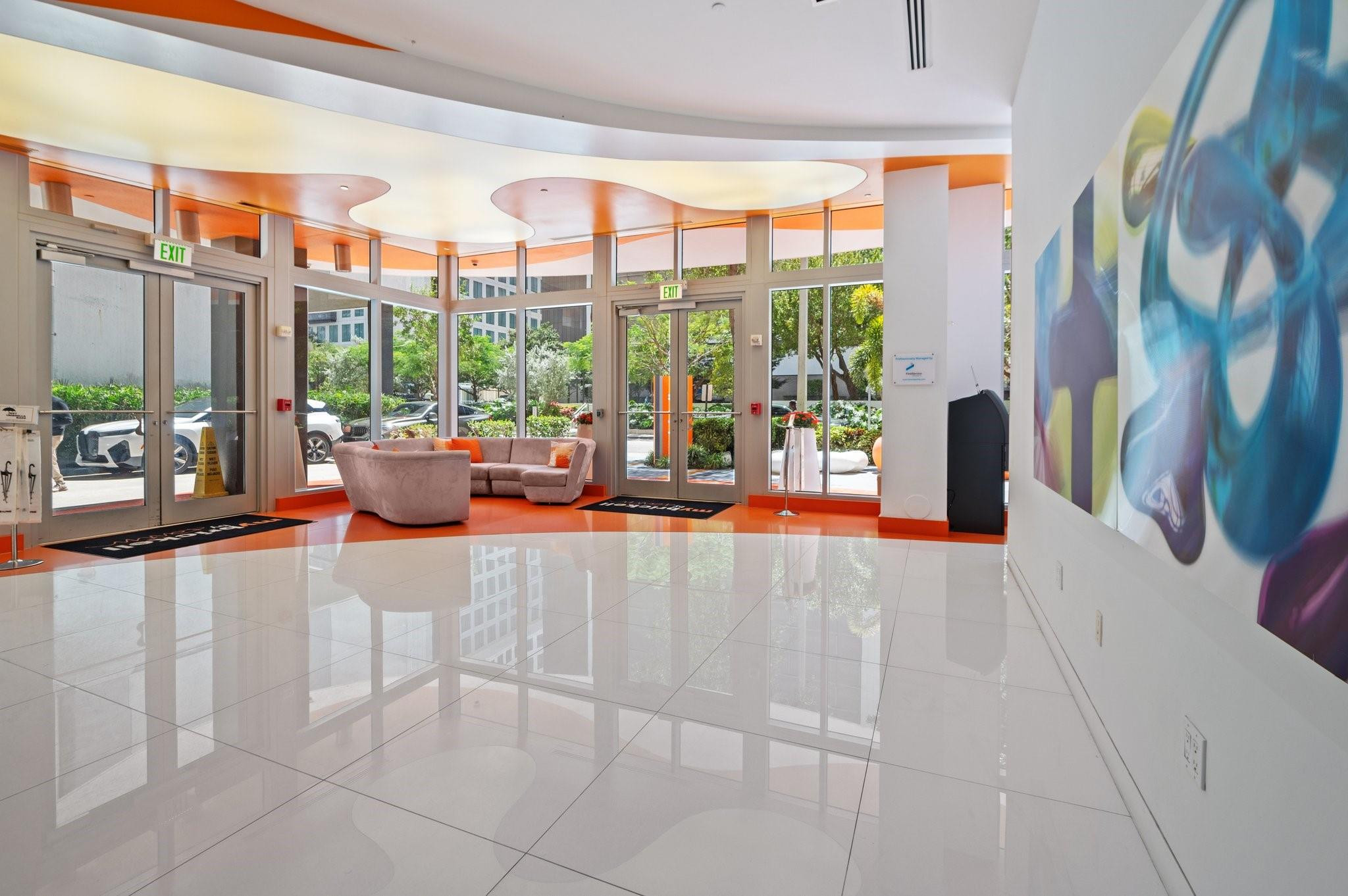 31 Southeast 6th Street, Unit 2002 Miami, FL 33131 - Photo 21 of 24 a living room with furniture and a large window