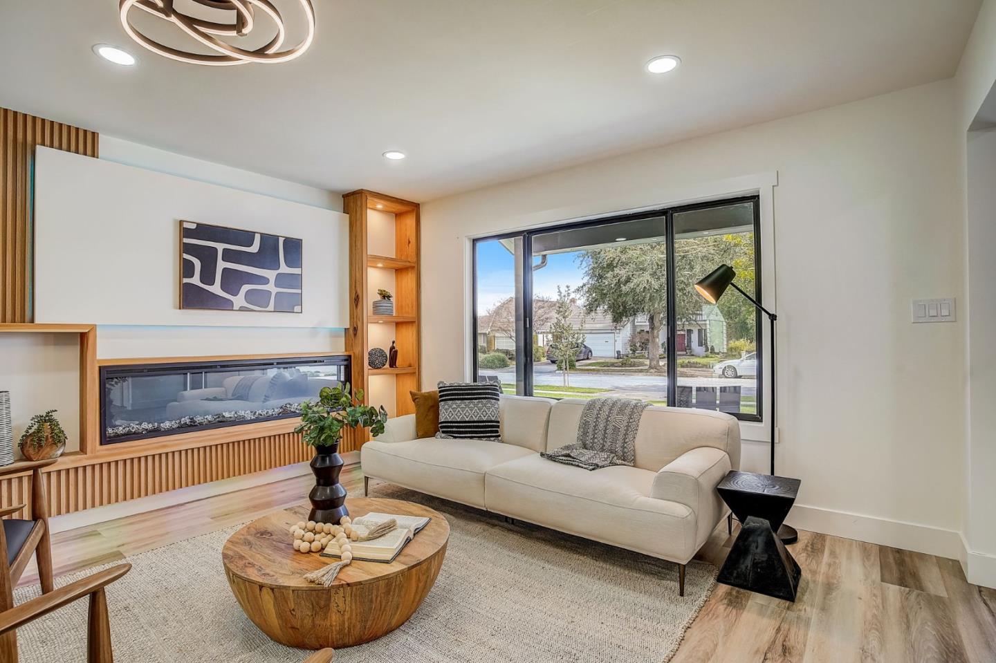1237 Collins Lane San Jose, CA 95129 - Photo 11 of 56 a living room with furniture and a large window