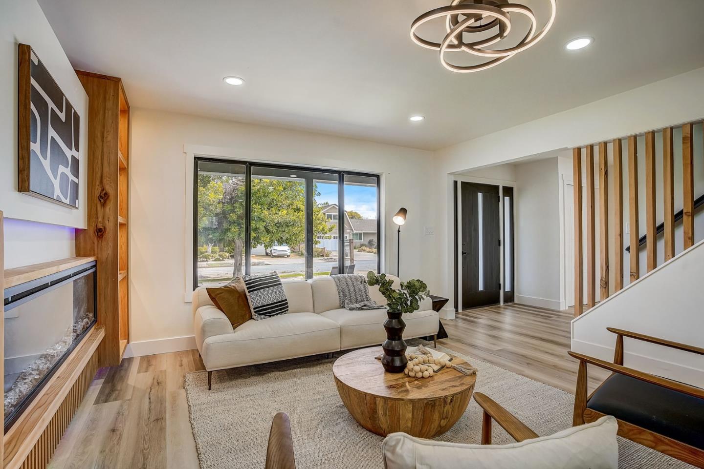 1237 Collins Lane San Jose, CA 95129 - Photo 12 of 56 a living room with furniture and a large window
