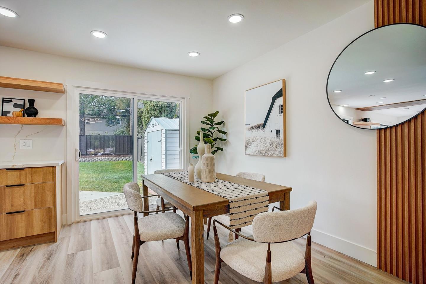 1237 Collins Lane San Jose, CA 95129 - Photo 14 of 56 a view of a dining room with furniture window and wooden floor