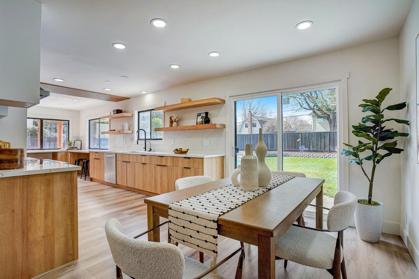 1237 Collins Lane San Jose, CA 95129 - Photo 15 of 56 a view of a dining room with furniture window and wooden floor