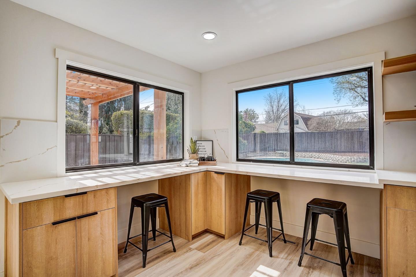 1237 Collins Lane San Jose, CA 95129 - Photo 19 of 56 a view of a large window with chair and table