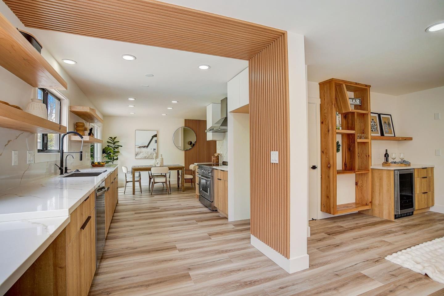 1237 Collins Lane San Jose, CA 95129 - Photo 20 of 56 a kitchen with stainless steel appliances lots of counter top space and wooden floor