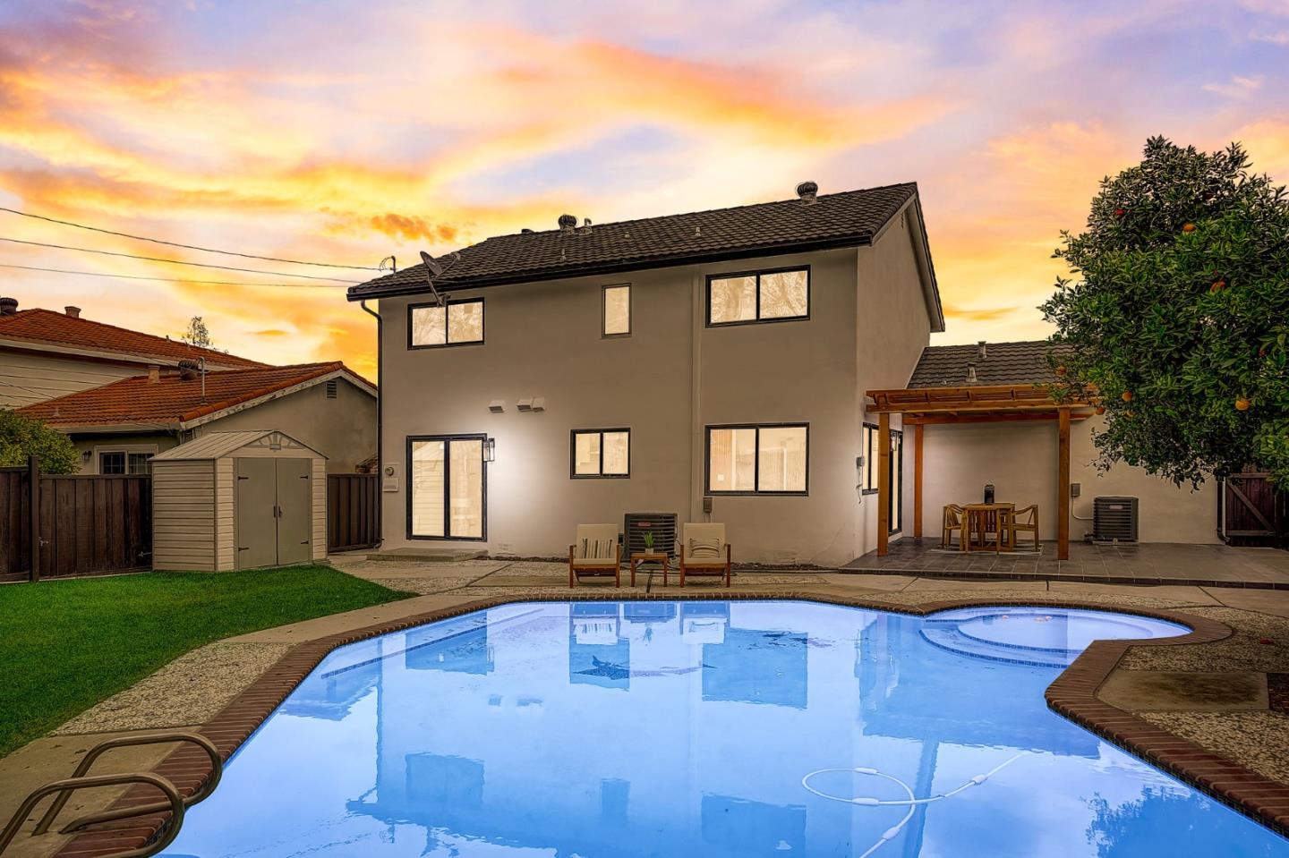 1237 Collins Lane San Jose, CA 95129 - Photo 2 of 56 a front view of a house with swimming pool