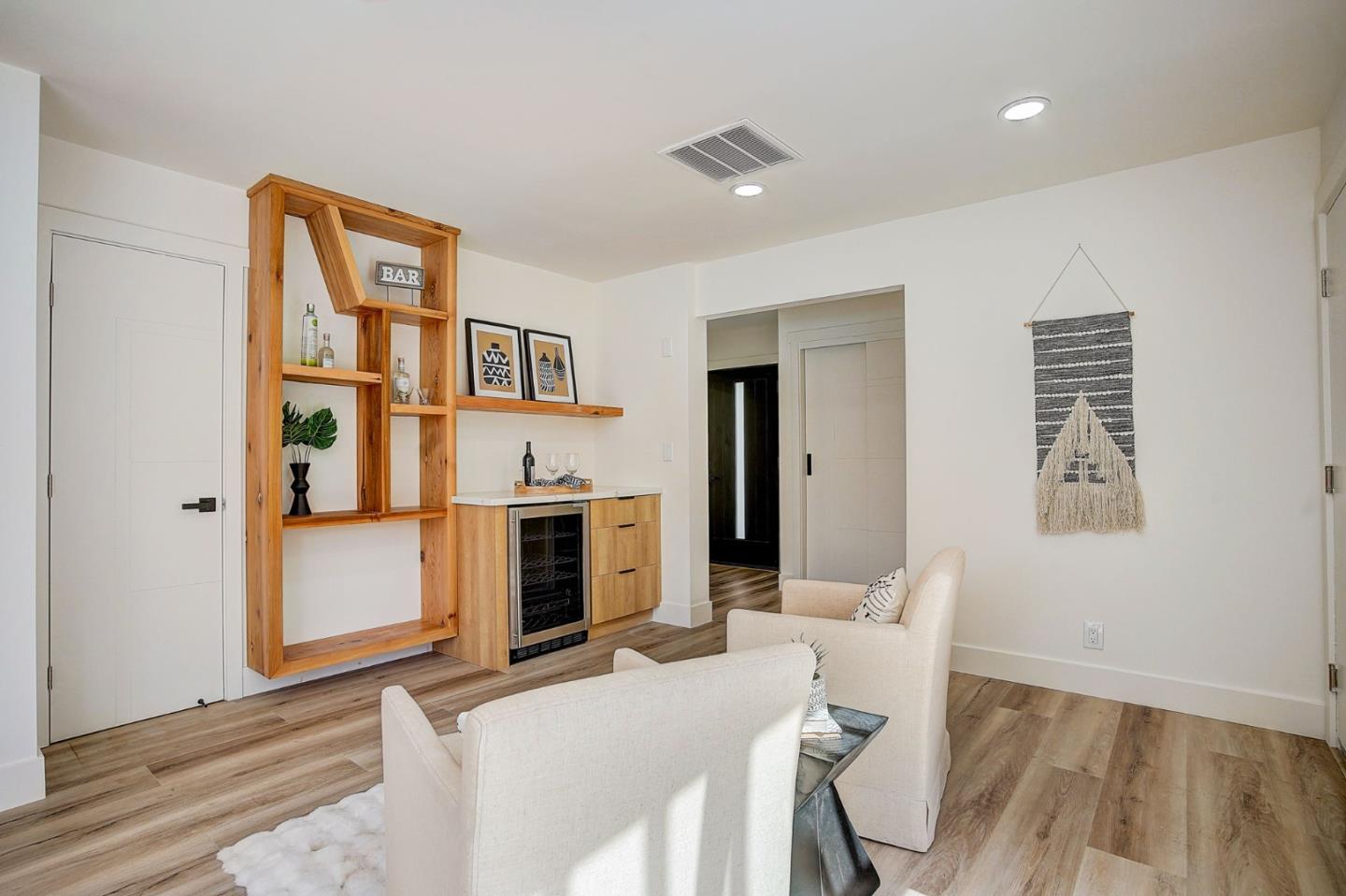 1237 Collins Lane San Jose, CA 95129 - Photo 27 of 56 a living room with furniture and a fireplace