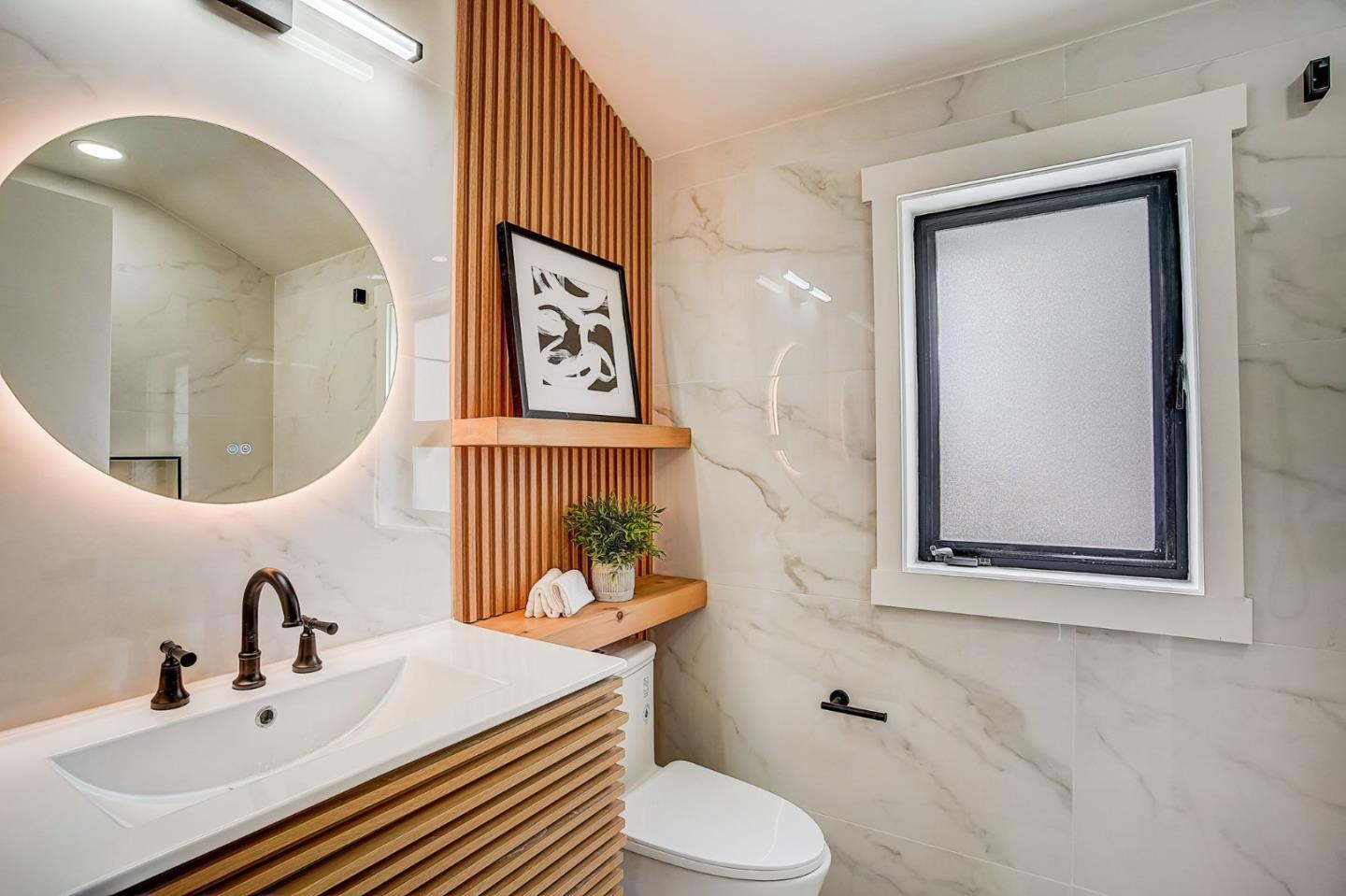1237 Collins Lane San Jose, CA 95129 - Photo 30 of 56 a bathroom with a sink mirror and toilet