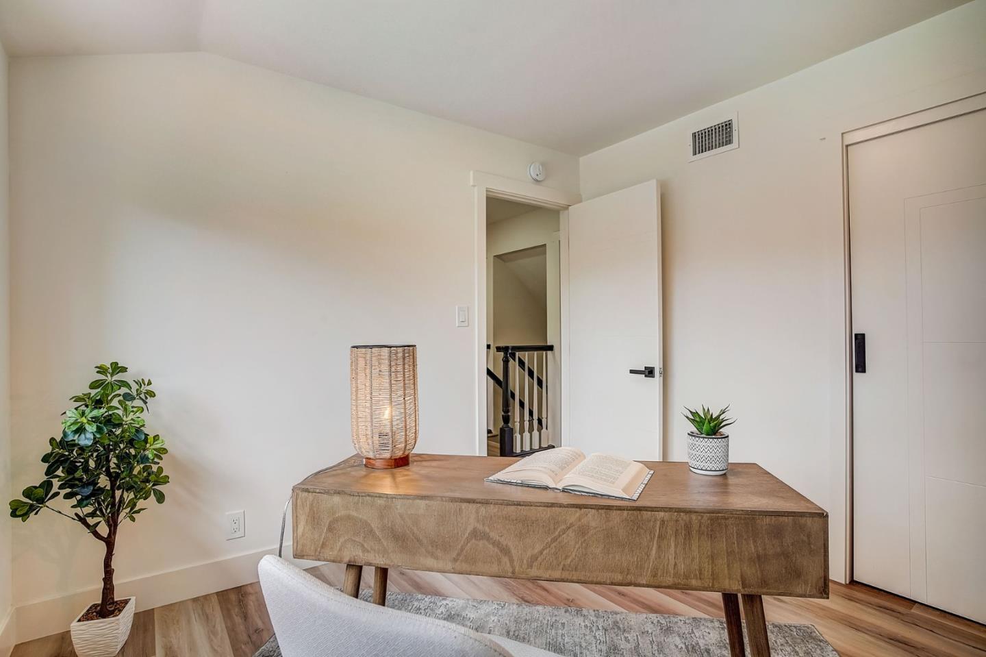 1237 Collins Lane San Jose, CA 95129 - Photo 33 of 56 a bedroom with a bed and a potted plant