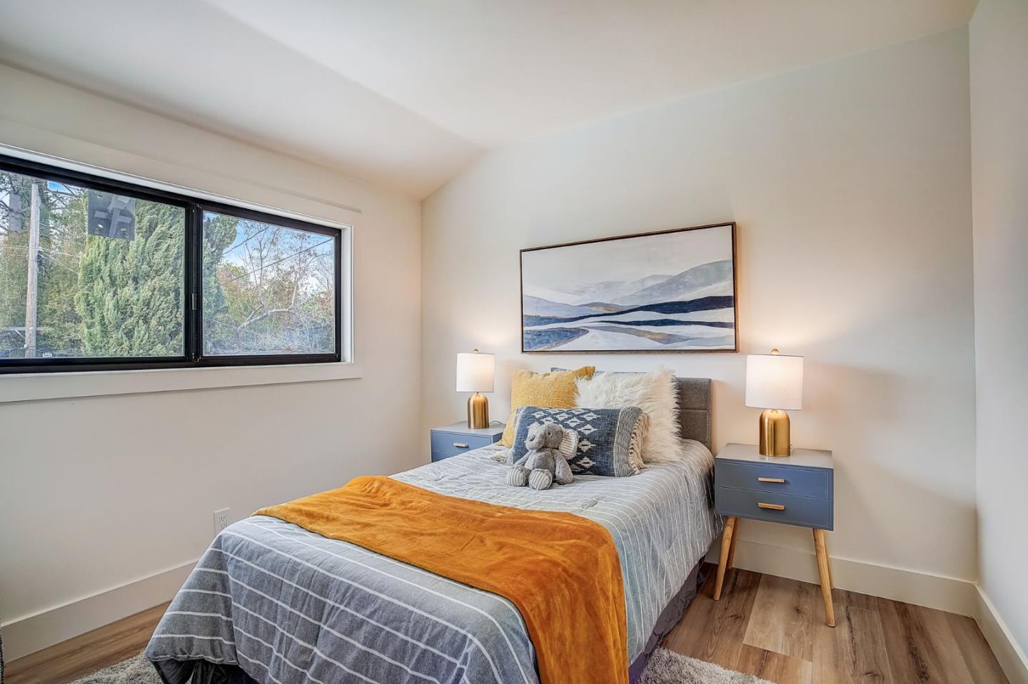 1237 Collins Lane San Jose, CA 95129 - Photo 38 of 56 a bedroom with a bed and wooden floor