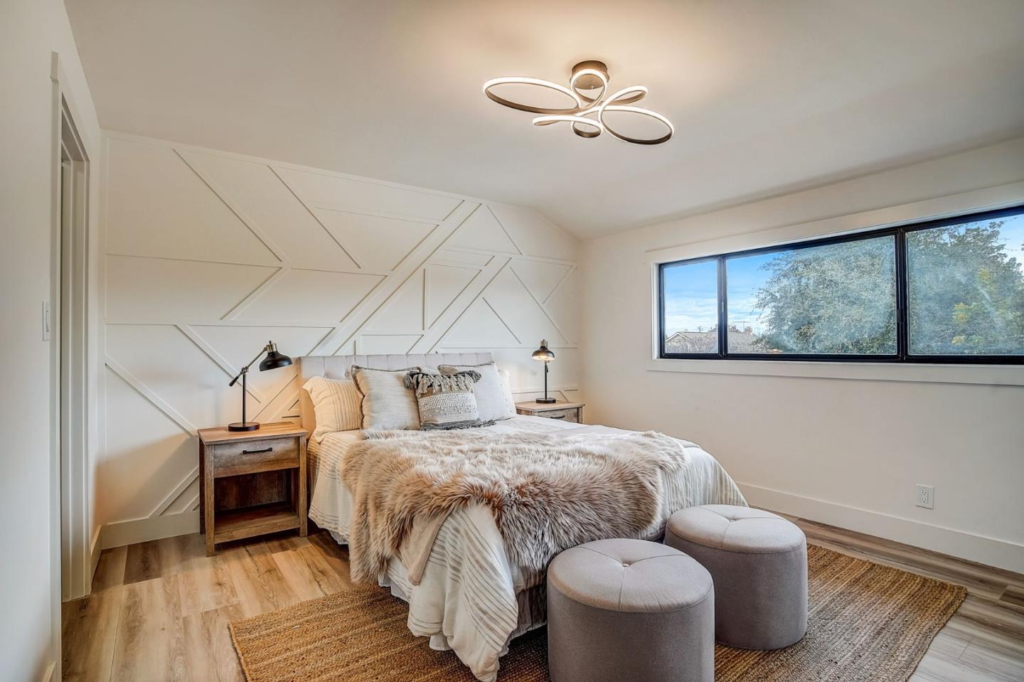 1237 Collins Lane San Jose, CA 95129 - Photo 40 of 56 a bedroom with bed and wooden floor