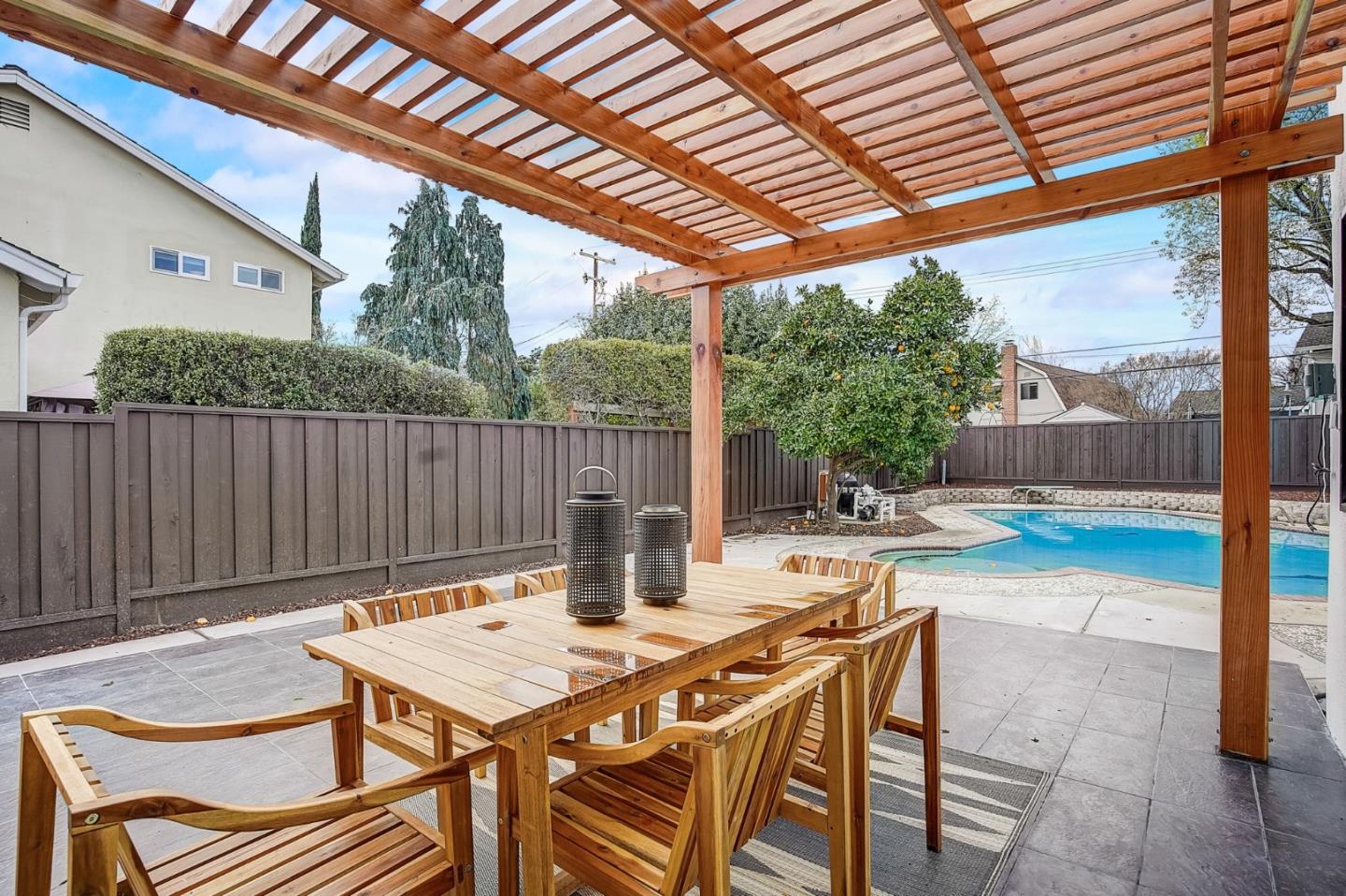 1237 Collins Lane San Jose, CA 95129 - Photo 44 of 56 a backyard of a house with table and chairs