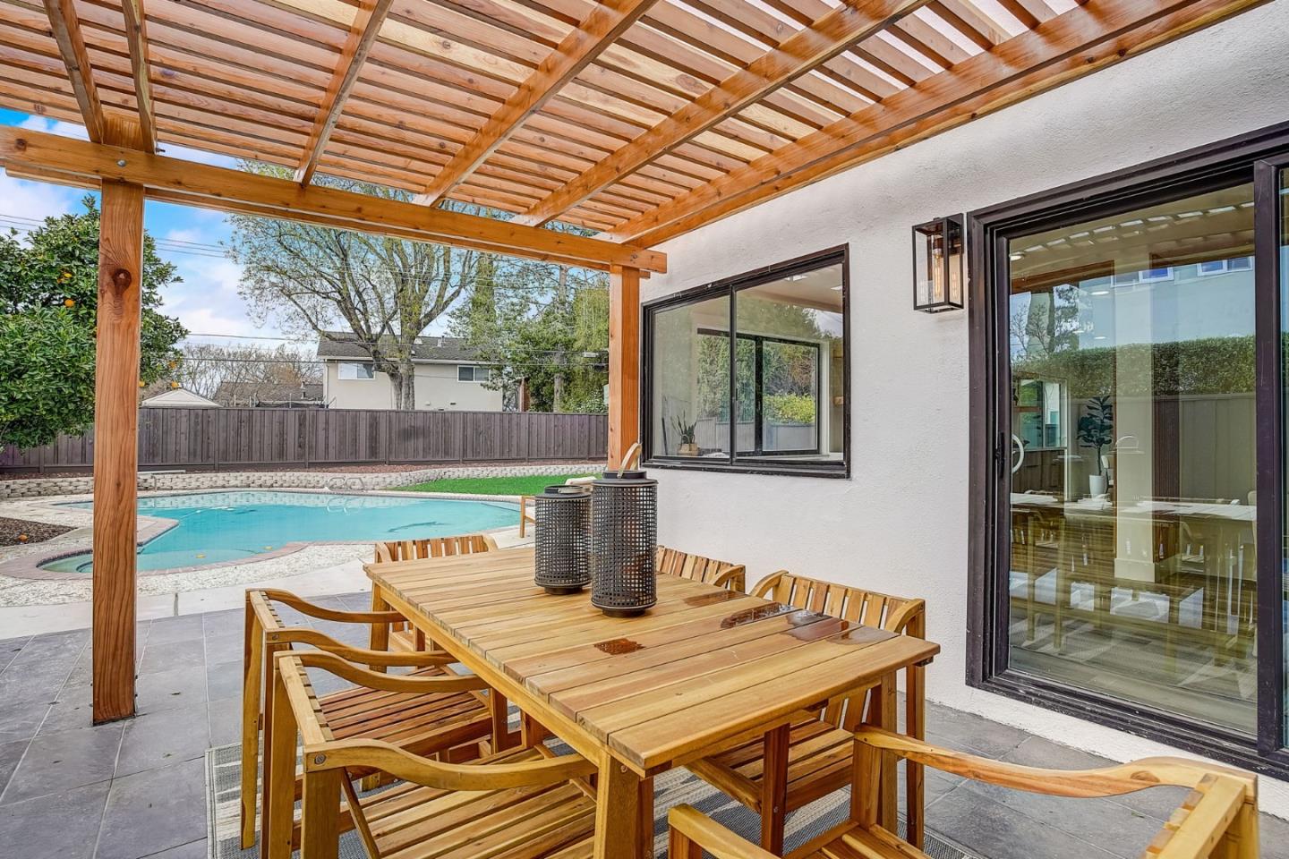 1237 Collins Lane San Jose, CA 95129 - Photo 45 of 56 a view of a patio with a table and chairs