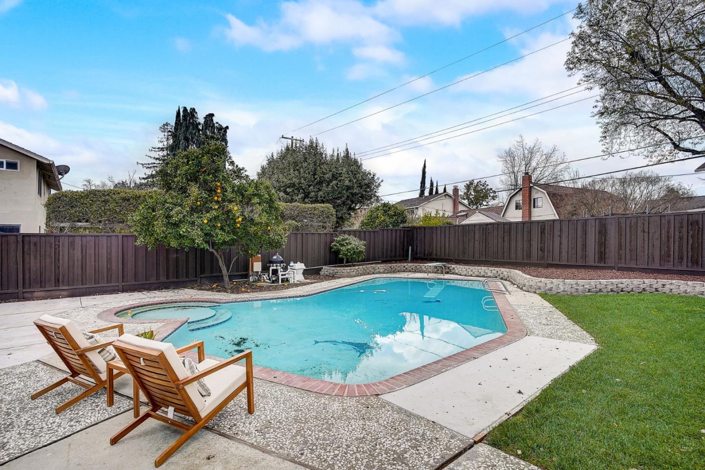 1237 Collins Lane San Jose, CA 95129 - Photo 47 of 56 a view of a backyard with swimming pool and sitting area