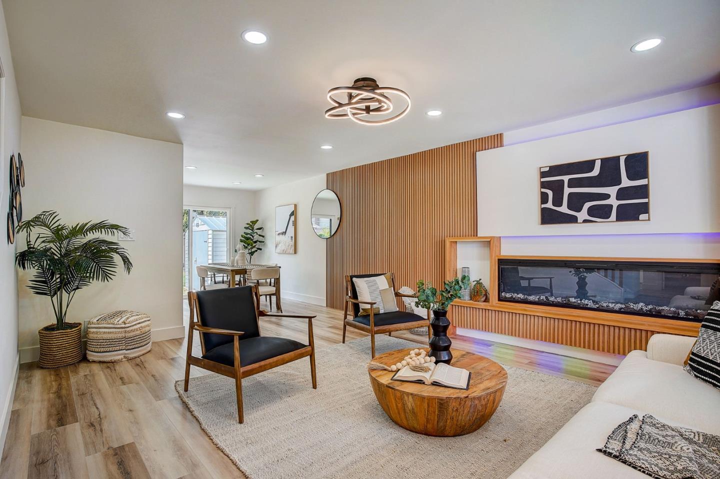 1237 Collins Lane San Jose, CA 95129 - Photo 10 of 56 a living room with furniture and a potted plant