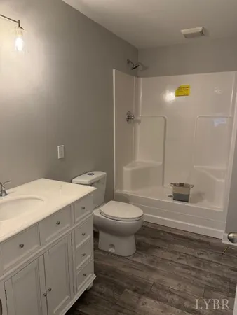 a bathroom with a toilet a sink and bathtub