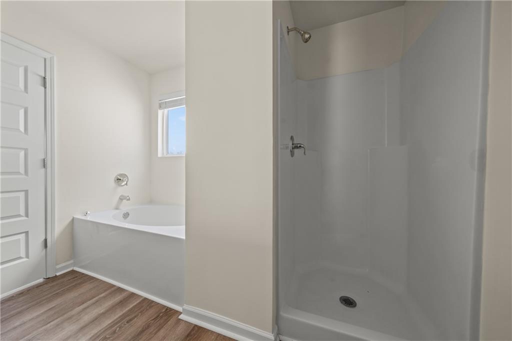 631 Carlton Pointe Drive, Unit 24 Palmetto, GA 30268 - Photo 13 of 20 a bathroom with a bathtub and shower